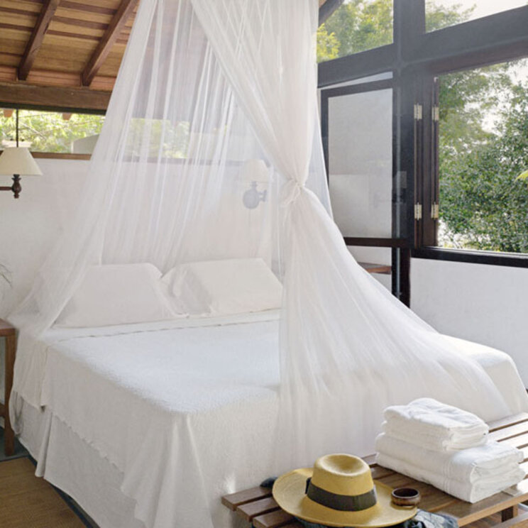 Bett einer Suite im Hotel O Sitío auf der Ilha Grande